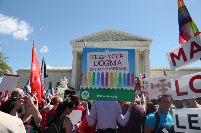 Traditional marriage and LGBT demonstrators gather around the steps of the Supreme Court building in Washington D.C. on April 28, 2015 for the oral arguments for Obergefell v. Hodges.