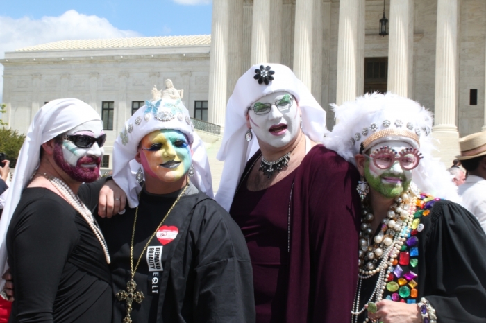 A group of drag queen demonstrators from Washington D.C. gather around the steps of the Supreme Court building on April 28, 2015, for the oral arguments for Obergefell v. Hodges.