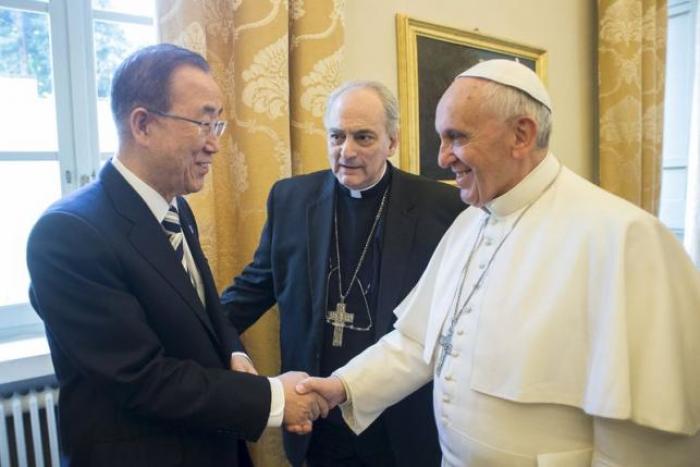 Pope Francis shakes hands with United Nations Secretary-General Ban Ki-moon (L) during a meeting at the Vatican April 28, 2015.