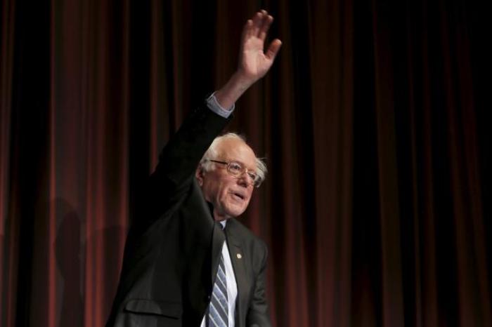 U.S. Senator Bernie Sanders, I-Vt., waves to the audience before speaking at the opening of the 2015 National Action Network Convention in New York City April 8, 2015.