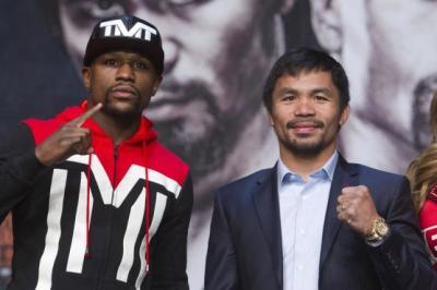Undefeated WBC/WBA welterweight champion Floyd Mayweather Jr. of the U.S. and WBO welterweight champion Manny Pacquiao of the Philippines pose during a final news conference at the MGM Grand Arena in Las Vegas, Nevada, April 29, 2015