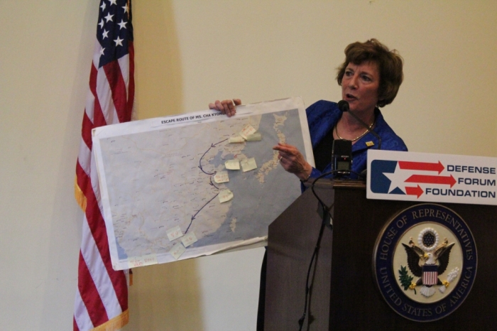 Suzanne Scholte, president of the Defense Forum Foundation, shows a map of one North Korean women's journey to escape from the North Korean sex trafficking market. Scholte hosted a delegation of North Korean defectors for a North Korea Freedom Week forum in Washington, D.C. on May 1, 2015.