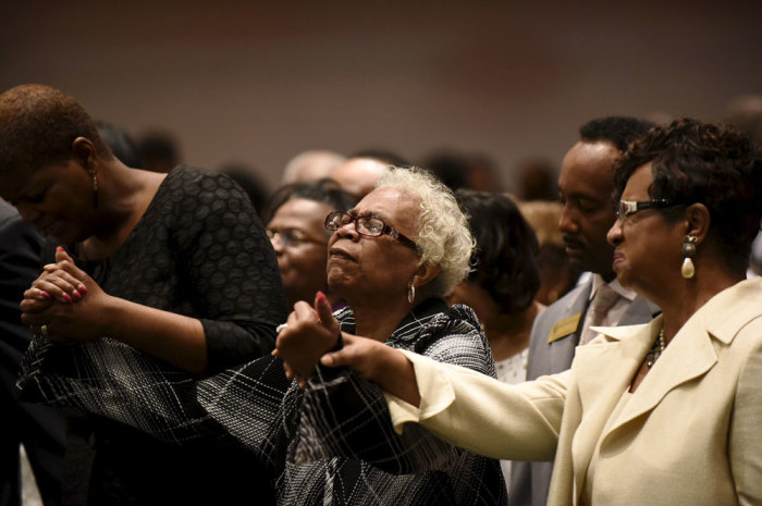Members of the community pray during Sunday morning worship at New Shiloh Baptist Church, where Freddie Gray's April 27 funeral service was held in Baltimore, May 3, 2015. The city of Baltimore was on Sunday to observe a day of prayer two weeks after Gray, a 25-year-old black man, died of injuries suffered in police custody in a case that has led to criminal charges against six officers.