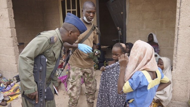 A soldier from the Nigerian Army talks with hostage women and children who were freed from Boko Haram, in Yola, in this April 29, 2015, handout. Nigeria's military rescued another set of women and children who had been kidnapped by Boko Haram militia and were being detained in Sambisa forest where the Islamist group has been holed up, an army spokesman said on April 30.