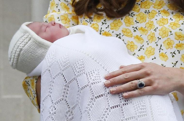 Britain's Catherine, Duchess of Cambridge, holds her baby daughter outside the Lindo Wing of St Mary's Hospital, in London, Britain May 2, 2015.