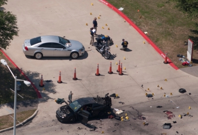An aerial view shows the area around a car that was used the previous night by two gunmen, who were killed by police, as it is investigated by local police and the FBI in Garland, Texas, May 4, 2015. Texas police shot dead two gunmen who opened fire on Sunday outside a free-speech event that included an art exhibit featuring caricatures of Muhammad.