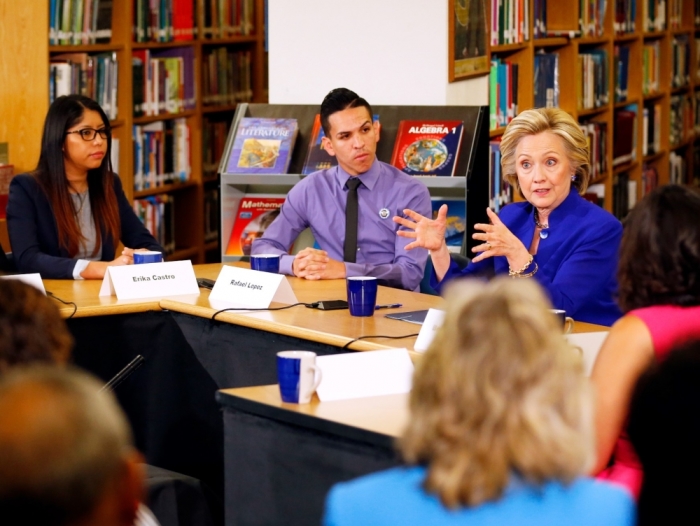 Former U.S. Secretary of State Hillary Clinton (R) takes part in a roundtable of young Nevadans discussing immigration as she campaigns for the 2016 Democratic presidential nomination at Rancho High School in Las Vegas, Nevada, May 5, 2015.