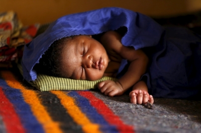 A baby born in captivity to one of the women rescued from Boko Haram in Sambisa forest sleeps at a clinic at the Internally Displaced People's camp in Yola, Nigeria, May 3, 2015. Hundreds of traumatised Nigerian women and children rescued from Boko Haram Islamists have been released into the care of authorities at a refugee camp in the eastern town of Yola, an army spokesman said.