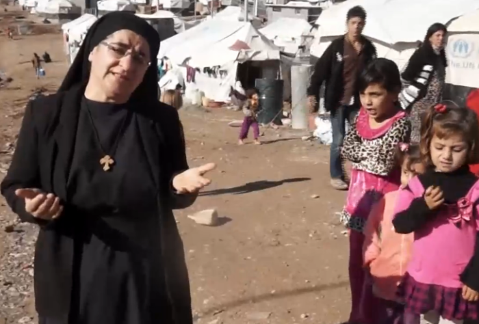 Sister Hatune Dogan with Yazidi refugees.
