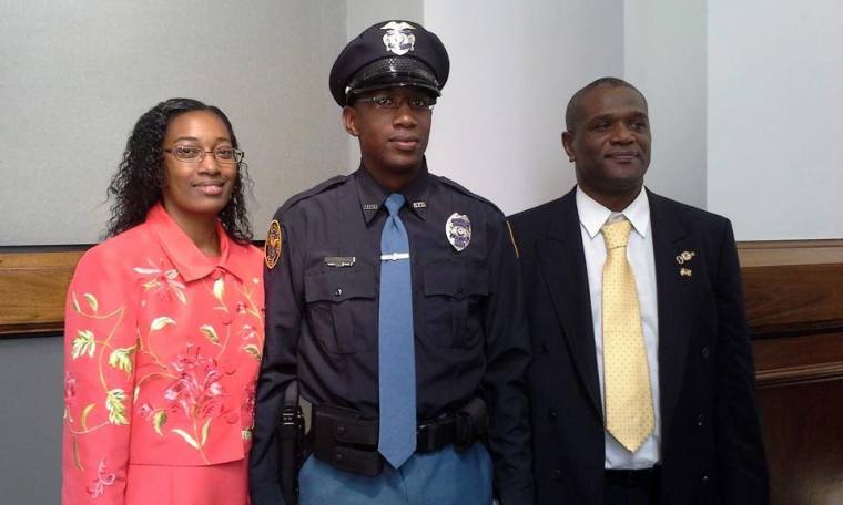 Hattiesburg Police Officer Liquori Tate was fatally shot during a traffic stop on May 9, 2015. He is pictured here with his parents Youlander Ross and Ronald Tate.