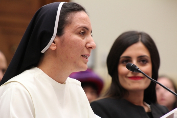 Sister Diana Momeka (left), an Iraqi nun, testifies before the House Foreign Affairs Committee on May 13, 2015 at the Rayburn House Office Building in Washington D.C.