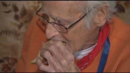 Clarence Blackmon eats a sandwich delivered to him by a local 911 operator.