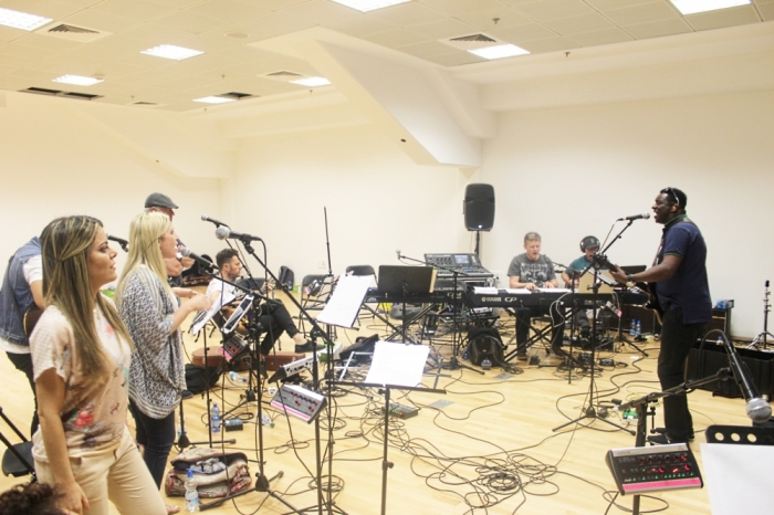 Ana Paula Valadao (L) and members of the Empowered21 2015 Congress worship team rehearse at the Jerusalem Pais Arena in Jerusalem, Israel, on Tuesday May 19, 2015.