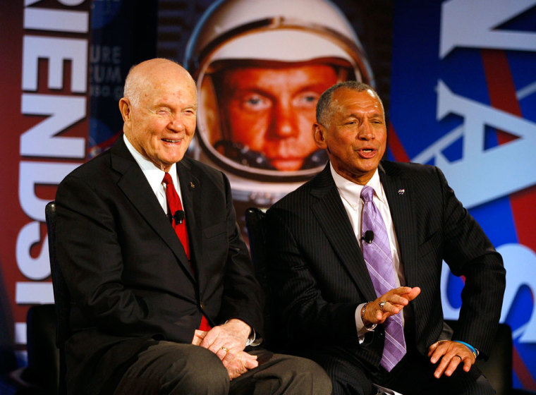Former astronaut and U.S. Senator John Glenn (L) and NASA Administrator Charles Bolden speak live with the crew of the International Space Station as they kick off the agency's two-day Future Forum at The Ohio State University in Columbus, Ohio February 20, 2012. This is part of a celebration of the 50-year anniversary of Glenn's famous orbit around earth in 1962.
