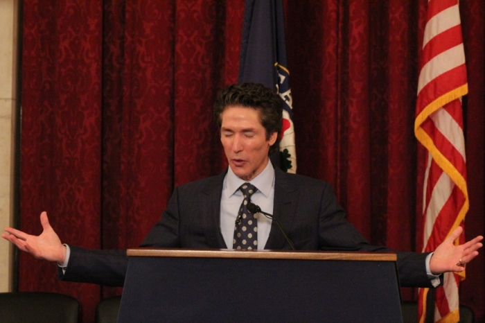 Televangelist Joel Osteen prays during a breakfast honoring military caregivers on May 21, 2015, at the Russell Senate Office Building in Washington D.C.
