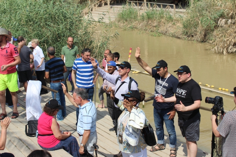 Christians pray at the Jordan River in Israel on Saturday May 23, 2015.