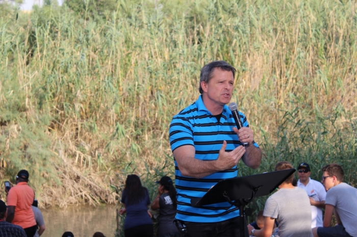 Ron Luce, co-founder and president of Teen Mania Ministries located in Garden Valley, Texas talks about the importance of baptism at the Jordan River, Israel on Saturday May 23, 2015.