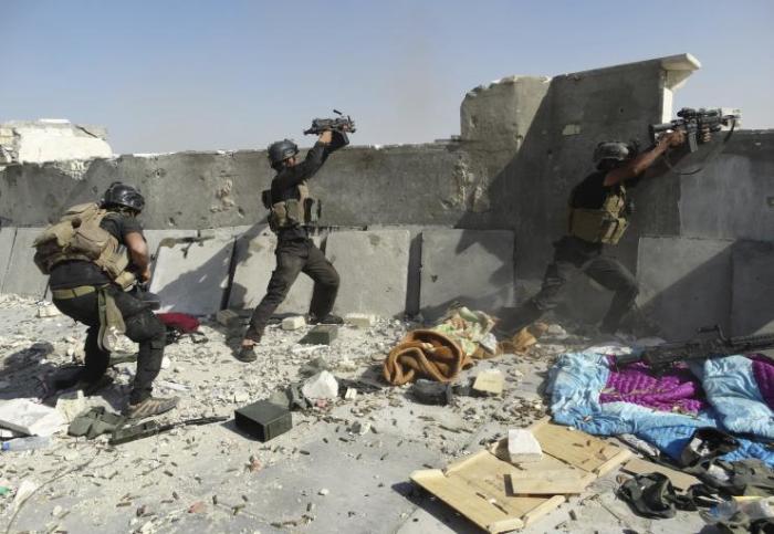 Members of Iraqi special-operations forces prepare for an Islamic State attack in June. The militant group launched a massive attack on the provincial capital Ramadi, May 2015.