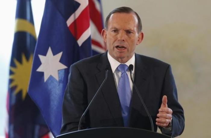 Australian Prime Minister Tony Abbott speaks at a joint news conference with his Malaysian counterpart Najib Razak during an official visit in Putrajaya September 6, 2014.