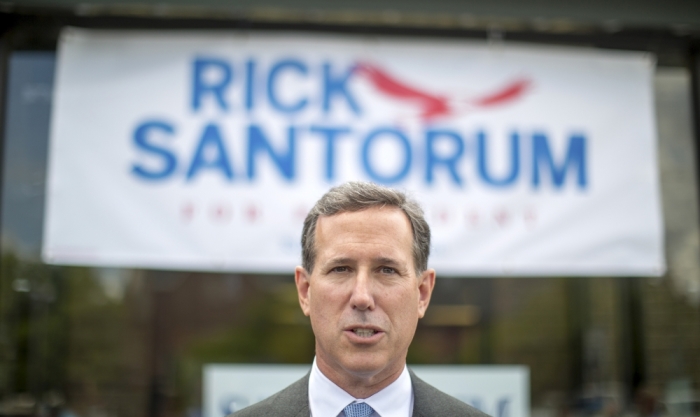 Republican presidential candidate and former U.S. Senator Rick Santorum speaks with the press during a campaign stop at Tommy's Ham House in Greenville, South Carolina, May 31, 2015.