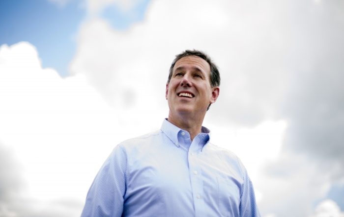 Republican presidential candidate and former U.S. Senator Rick Santorum looks up as he prepares to leave during a campaign stop at the Food Truck Bash in Travelers Rest, South Carolina, May 31, 2015.