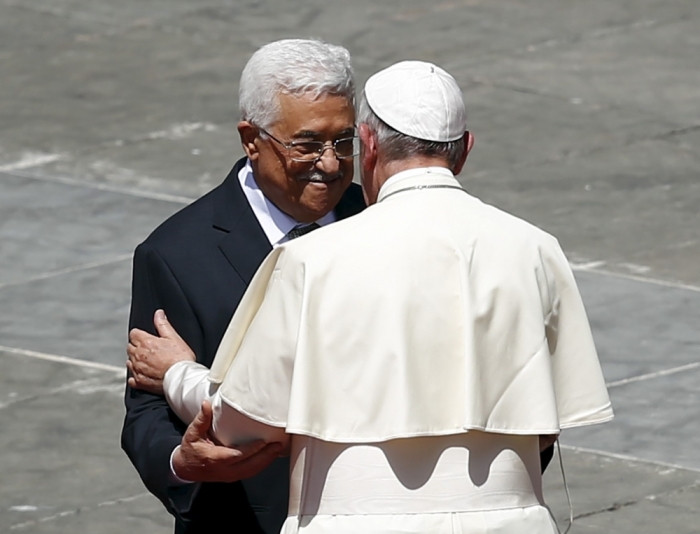 Pope Francis (R) embraces Palestinian President Mahmoud Abbas at the end of the ceremony for the canonisation of four nuns at Saint Peter's square in the Vatican City, May 17, 2015. The four nuns being canonised include two Palestininan nuns, Marie Alphonsine Ghattas, founder of the first Catholic congregation in Palestine, and Mariam Baouardy Haddad, who established a Carmelite convent in Bethlehem.