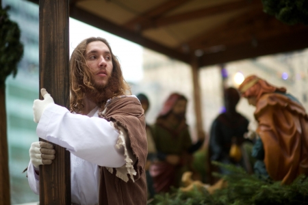 Michael Grant, 28, "Philly Jesus," clutches the 12 foot cross he had carried 8 miles through North Philadelphia to Center City as part of a Christmas walk to spread the true message of the holiday in Philadelphia, Pennsylvania, December 20, 2014. As many as a half dozen others joined him for numerous miles as he trekked southward down Broad Street. Some shouted "Praise Jesus!" and "Thank you for doing this!"?at the sight. Nearly everyday for the last 8 months, Grant has dressed as Jesus Christ, and walked the streets of Philadelphia to share the Christian gospel by example. He quickly acquired the nickname of "Philly Jesus," which he has gone by ever since.