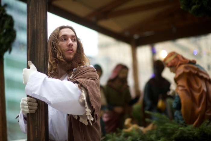 Michael Grant, 28, 'Philly Jesus,' clutches the 12 foot cross he had carried 8 miles through North Philadelphia to Center City as part of a Christmas walk to spread the true message of the holiday in Philadelphia, Pennsylvania, December 20, 2014. As many as a half dozen others joined him for numerous miles as he trekked southward down Broad Street. Some shouted 'Praise Jesus!' and 'Thank you for doing this!'?at the sight. Nearly everyday for the last 8 months, Grant has dressed as Jesus Christ, and walked the streets of Philadelphia to share the Christian gospel by example. He quickly acquired the nickname of 'Philly Jesus,' which he has gone by ever since.