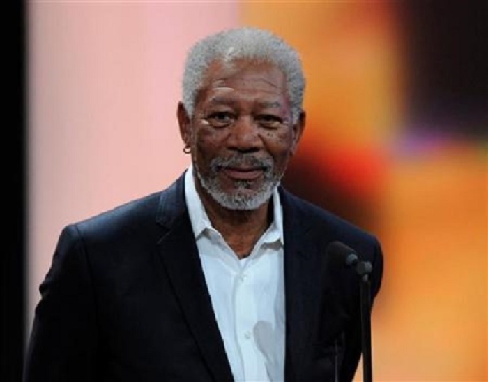 U.S. actor Morgan Freeman receives his trophy for Category ''International Lifetime Achievement'' during the 47th Golden Camera award ceremony in Berlin February 4, 2012.