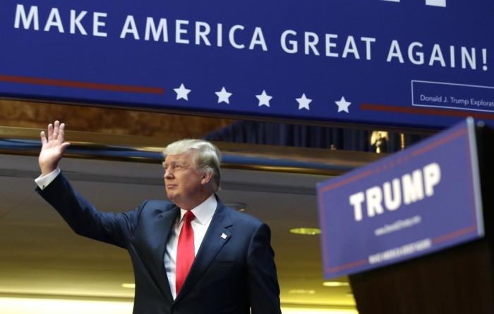 U.S. Republican presidential candidate, real estate mogul and TV personality Donald Trump acknowledges supporters prior to formally announcing his campaign for the 2016 Republican presidential nomination during an event at Trump Tower in New York, June 16, 2015.