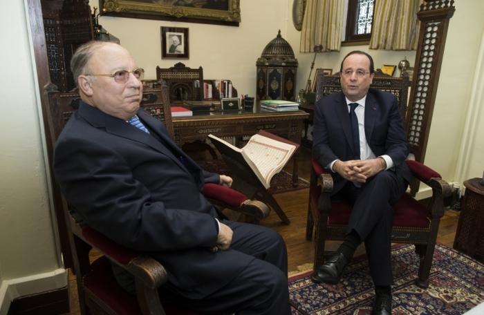 Paris Mosque rector Dalil Boubakeur (L) attends a meeting with French President Francois Hollande before a ceremony to inaugurate the memorial of the Muslim soldiers, who died fighting for France, at the Grand Mosque of Paris February 18, 2014. l