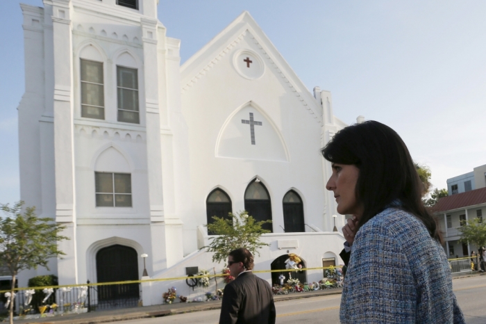 South Carolina Governor Nikki Haley (R) walks between television interviews outside the Emanuel African Methodist Episcopal Church in Charleston, South Carolina, June 19, 2015, two days after a mass shooting left nine dead during a Bible study at the church.