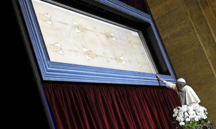 Pope Francis touches the shroud of Turin on June 21, 2015.