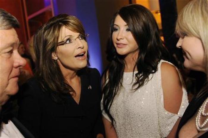 Former Governor of Alaska Sarah Palin (L) talks with her daughter Bristol Palin (R) as she arrives at the embassy of Italy.