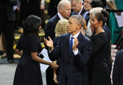 President Barack Obama and First Lady Michelle Obama attend the funeral service for Rev. Clementa Pinckney in the TD Arena in Charleston, South Carolina, June 26, 2015. President Barack Obama delivered the eulogy for Pinckney, the pastor of the historic church where the attack took place. Pinckney was one of the nine victims of the mass shooting at the church.