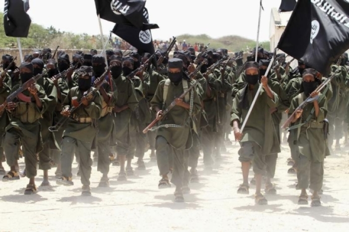 New recruits belonging to Somalia’s al-Qaeda-linked al-Shabaab rebel group march during a passing out parade at a military training base in Afgoye, west of the capital Mogadishu February 17, 2011.