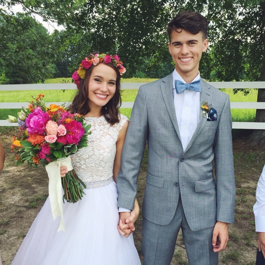 "Duck Dynasty" star John Luke Robertson married his fiancee, Mary Kate McEacharn, in a country style wedding on June 27, 2015.