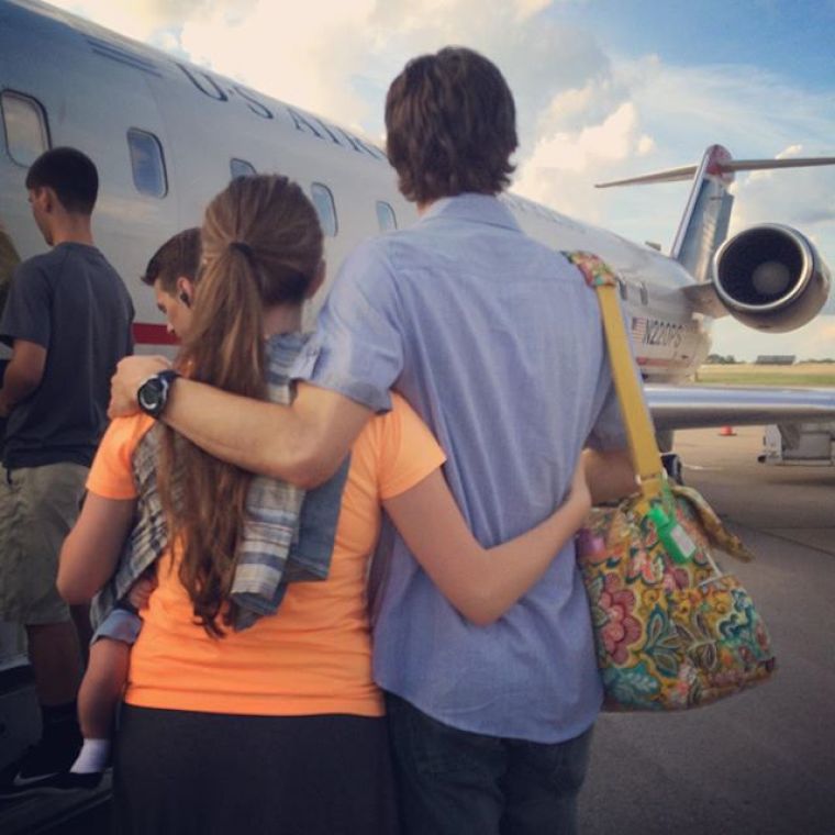 Jill (Duggar) Dillard and her husband, Derrick, and son, Israel David, board an airplane to embark on a long-term mission trip on July 5, 2015.