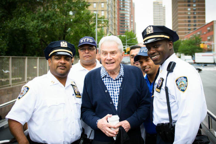 Evangelist Luis Palau poses for a photo with members of the New York Police Department.