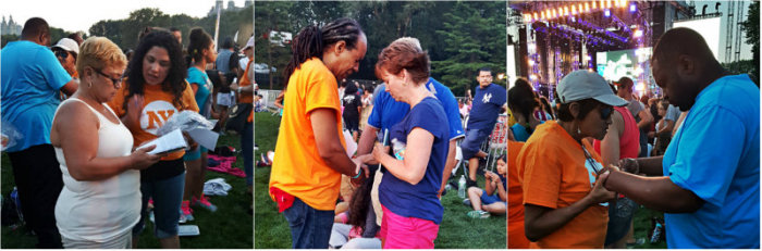 Volunteer counselors speak with attendees on the Great Lawn at Central Park during NY CityFest on July 11, 2015, in New York City.