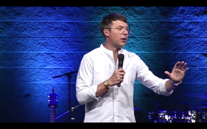 Pastor Judah Smith of The City Church preaching on how not to love the world in a sermon titled 'One Man's Trash Is Another Man's Treasure,' in Seattle, Washington, July 5, 2015.
