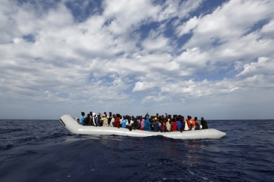 A rubber dinghy with 104 sub-Saharan Africans on board waiting to be rescued by the NGO Migrant Offshore Aid Station is seen some 25 miles off the Libyan coast in this handout photo provided by MOAS October 4, 2014. MOAS, a privately-funded humanitarian initiative, began operating at the end of August and has assisted in the rescue of some 2,200 migrants crossing from Libyan shores towards Europe.
