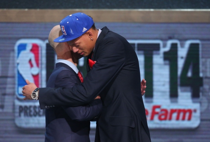 Jun 26, 2014; Brooklyn, NY, USA; Isaiah Austin (Baylor) hugs NBA commissioner Adam Silver after being selected as an honorary draft pick by the NBA during the 2014 NBA Draft at the Barclays Center. Austin was diagnosed with Marfan Syndrome ending his career.