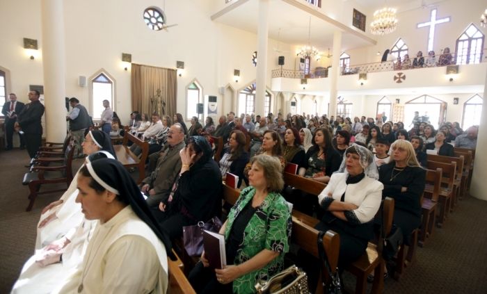 Iraqi Christians attend an Easter mass at the Virgin Mary church in Baghdad, April 5, 2015.