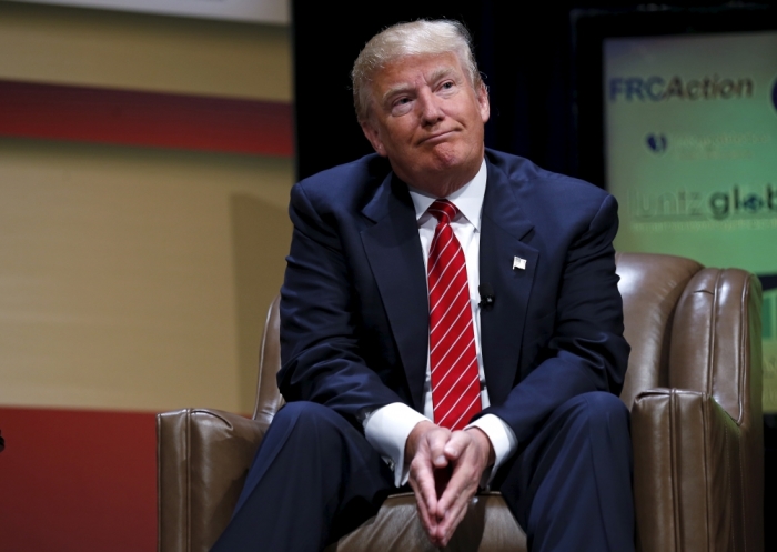 U.S. Republican presidential candidate Donald Trump listens to a question at the Family Leadership Summit in Ames, Iowa, United States, July 18, 2015.