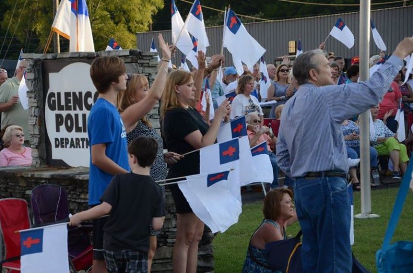 Over 500 people attend the "United We Stand" rally held in response to the removal of a Christian flag from the Glenco Police Department in Glenco, Alabama, Saturday, July 18, 2015.