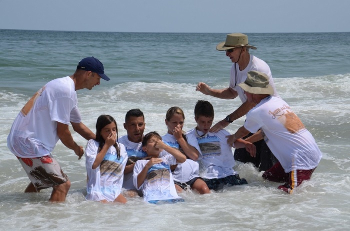 Baptisms held in the Atlantic Ocean as part of 'Jesus at the Beach,' an annual Christian fellowship event organized by the Son'Spot in Ocean City, Maryland.