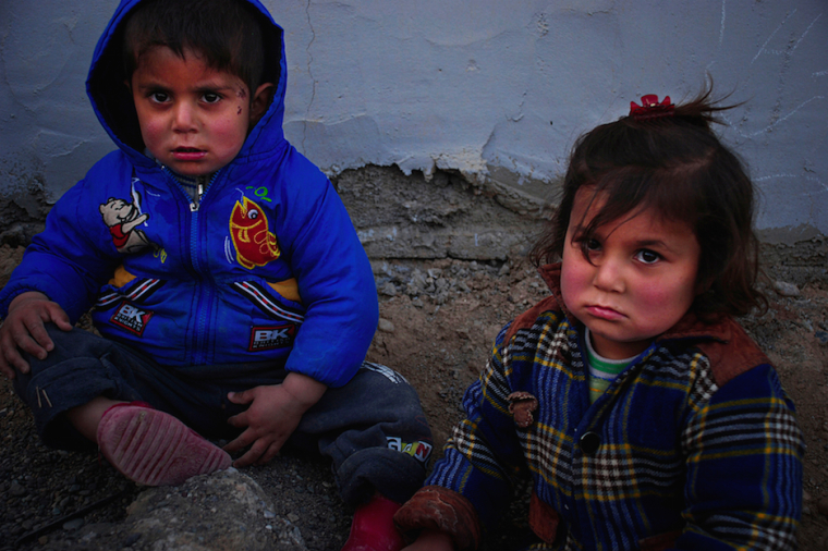 Syrian and Iraqi refugee children wait in the food lines in Erbil and Dohuk, Iraq, March 2015.