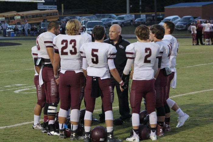 The Chestatee High School War Eagles gathered in a team huddle.