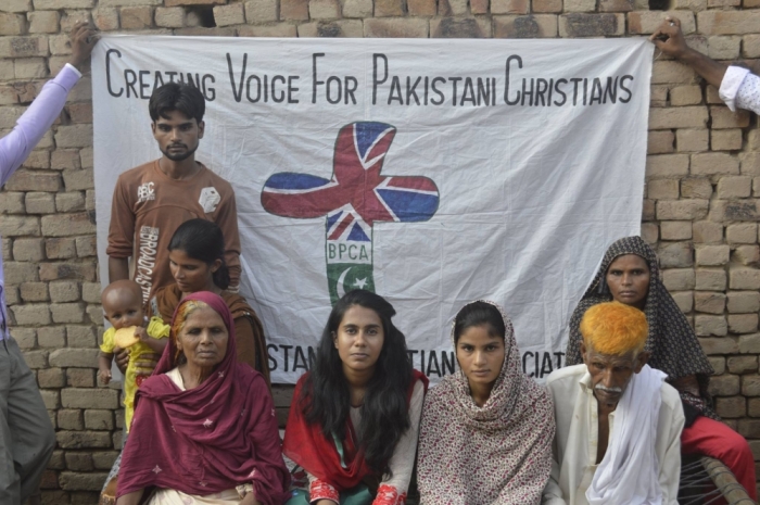 Fouzia Sadiq's family poses with British Pakistani Christian Association officer Mehwish Bhatti in this undated photo.